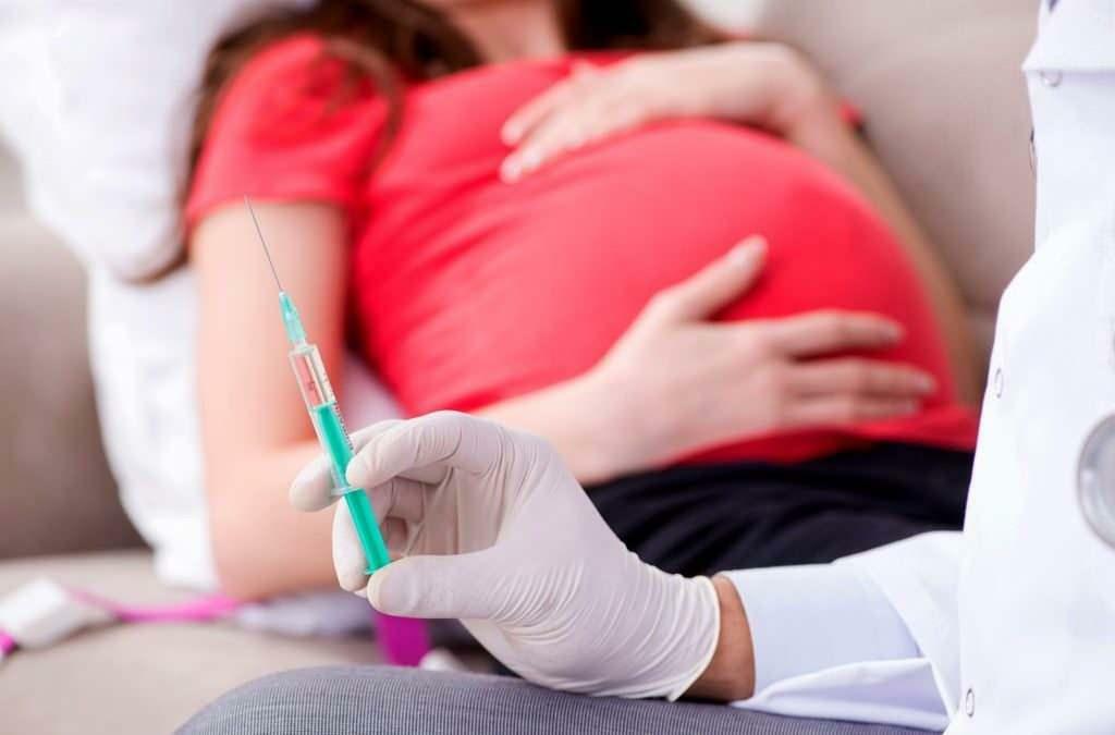In welke maanden van de zwangerschap moet het griepvaccin worden toegediend?