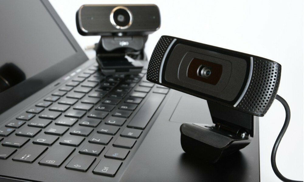 video-conferencing-zoom-camera-held