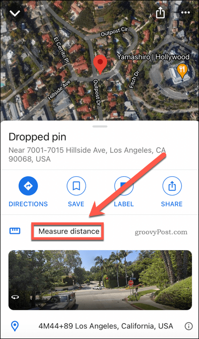 Google Maps meet afstand knop op mobiel